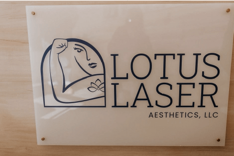 Lotus Laser Aesthetics logo sign displayed at the clinic entrance.